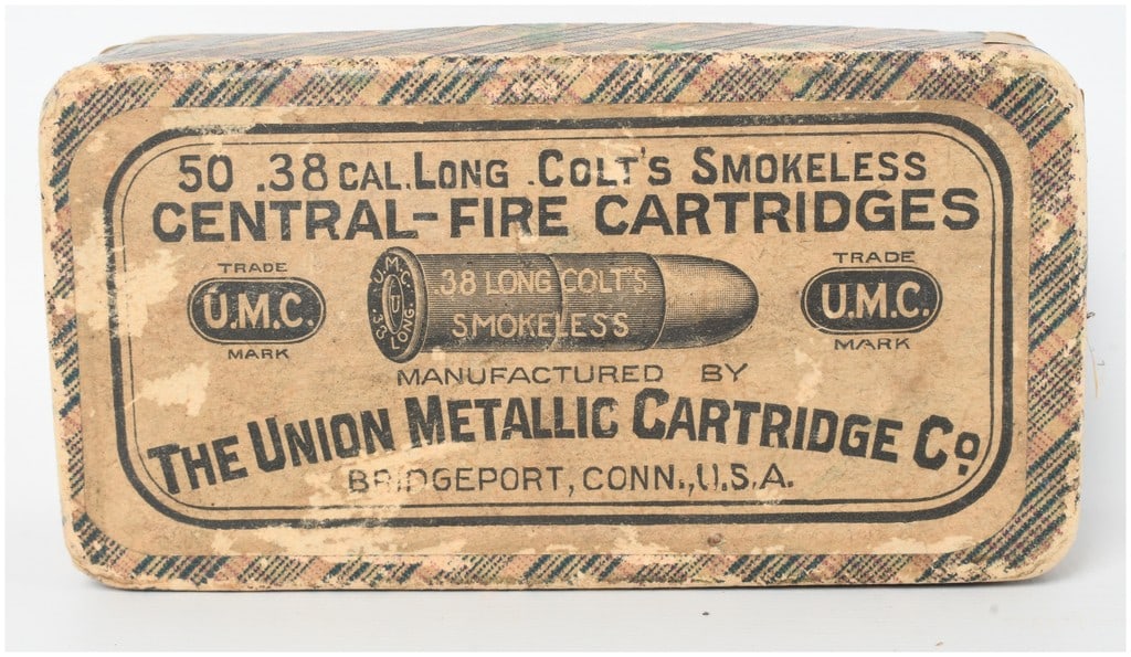 Remington-UMC .38 Long Colt Smokeless Central-Fire Cartridges a Lot of 50: A full two-piece cardboard box containing a Lot of 50 cartridges of .38 Long Colt ammunition. The box is finished with a green, red, and black plaid pattern and features a top label identifying the co