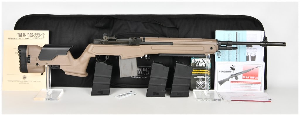 Springfield Armory M1A Semi-Automatic Rifle .308 with 22 Inch Barrel: This Springfield Armory M1A is a semi-automatic rifle chambered in .308 Winchester, featuring a National Match grade 22 inch barrel with a slotted flash suppressor. The barreled action is finished in 
