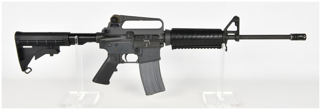 Colt AR-15 A2 Government Carbine Semi-Automatic Rifle 5.56mm NATO with 16 Inch Barrel: This is a Colt AR-15 A2 Government Carbine, a semi-automatic rifle chambered for 5.56mm NATO and .223 caliber ammunition. The firearm features a 16 inch barrel with a 1/7 twist rate, equipped with a s