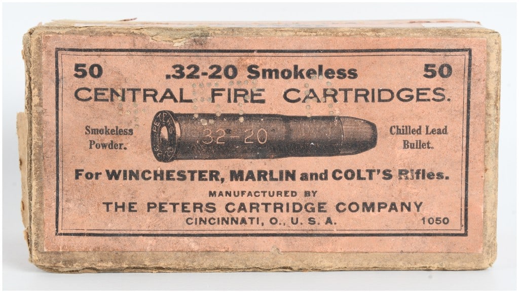 A Lot of 29 Peters Cartridge Company .32-20 Smokeless Central Fire Cartridges: This lot consists of a vintage collection of 29 .32-20 caliber smokeless central fire cartridges manufactured by The Peters Cartridge Company of Cincinnati, Ohio. The rounds are housed in a two-piece 