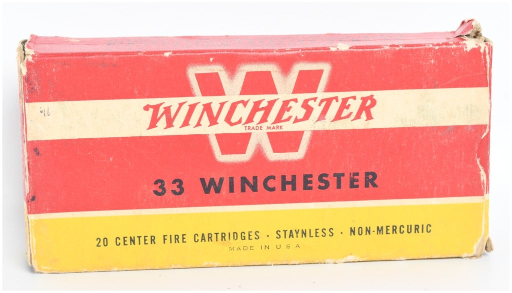 A Lot of 16 Winchester .33 Winchester 200 Grain Soft Point Ammunition Cartridges: This lot features a vintage two-piece box of Winchester .33 Winchester centerfire ammunition containing 14 live rounds and 2 empty brass casings. The cartridges are loaded with 200 grain soft point bu
