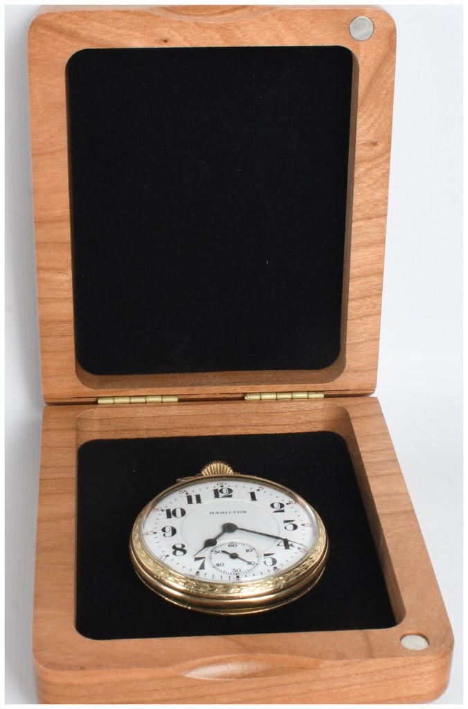 Hamilton 16 Size Gold Filled Railroad Grade Open Face Pocket Watch with Presentation Box: A vintage Hamilton open face pocket watch featuring a white double-sunk porcelain dial with bold black Arabic hour numerals and a red outer minute track in five-minute increments. A small seconds sub-