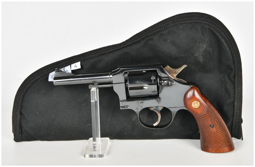Miroku Special Police Model Double Action Revolver .38 Special with 4 Inch Barrel: This Miroku Special Police Model is a double-action service revolver chambered in .38 Special. The firearm features a 4-inch barrel equipped with a fixed serrated ramp front sight and a square notch r