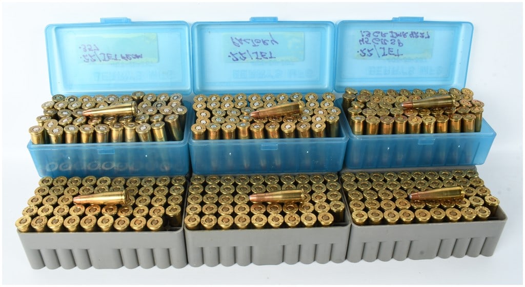 A Lot of 300 Rounds of Remington .22 Jet Centerfire Ammunition: This lot consists of 300 rounds of Remington .22 Jet centerfire ammunition, featuring jacketed soft-point bullets and brass cases. The cartridges are organized into six Berry's Mfg. plastic ammunition