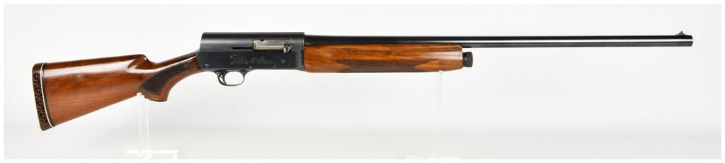 Browning Auto-5 Semi-Automatic Shotgun 12 Gauge: This Browning Auto-5 is a semi-automatic 12-gauge shotgun featuring the iconic long-recoil operating system and a blued finish. The firearm is equipped with a checkered walnut stock and forend, and an