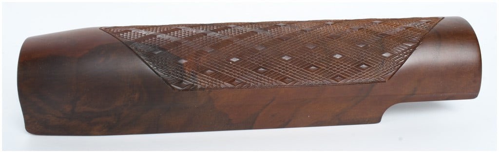 An Italian-Made Walnut Semi-Automatic Shotgun Forend: This is a single wooden forend designed for a semi-automatic shotgun, crafted from walnut with a smooth satin finish. The component is intended for use with a 12-gauge or similar sized action and feat