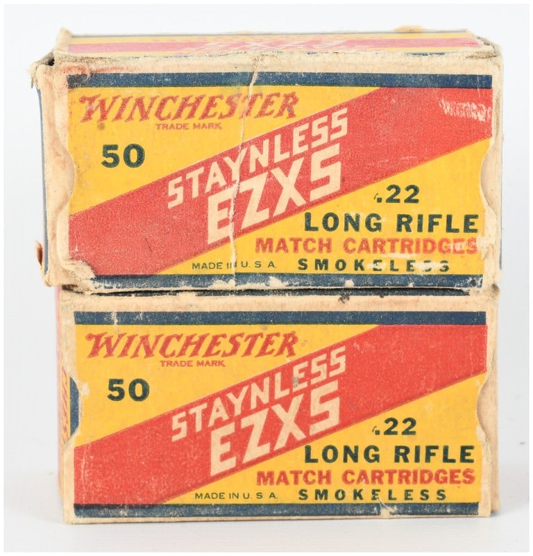 A Lot of 100 Rounds of Winchester Staynless EZXS .22 Long Rifle Match Ammunition: This lot consists of 100 rounds of vintage Winchester Staynless EZXS .22 Long Rifle match ammunition, presented in two original 50-round cardboard boxes. The cartridges are configured with lead projec