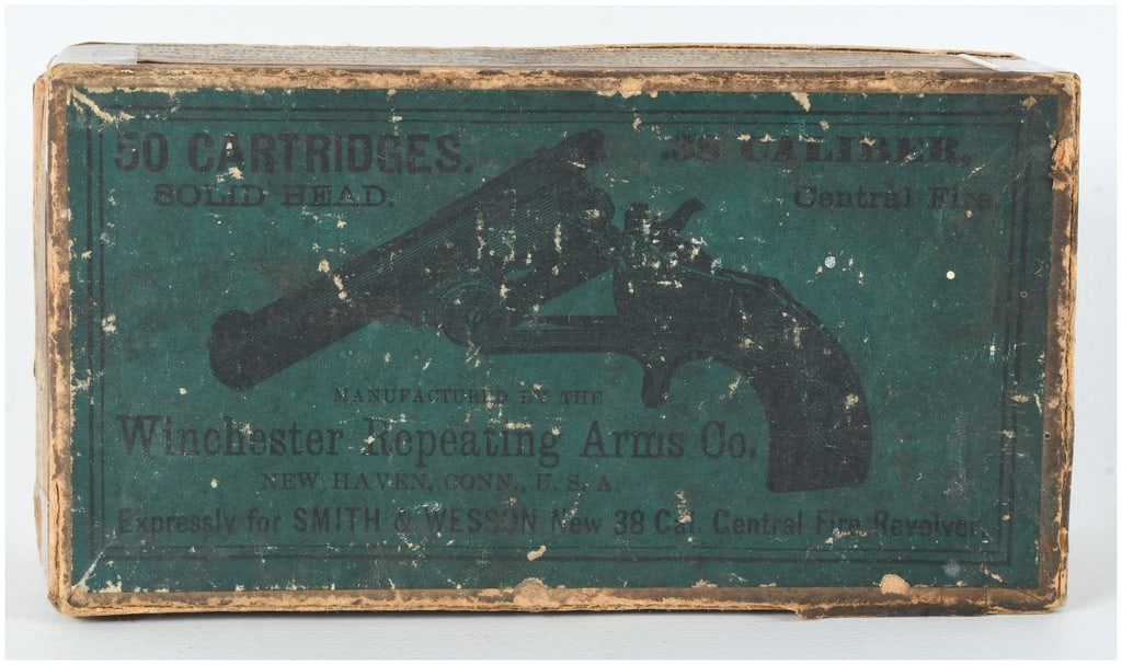 A Lot of 50 Winchester .38 S&W Caliber Central Fire Cartridges Antique: This lot features a full two-piece cardboard box containing 50 cartridges of Winchester .38 S&W caliber central fire ammunition. The green lid label is prominently marked MANUFACTURED BY THE Wincheste