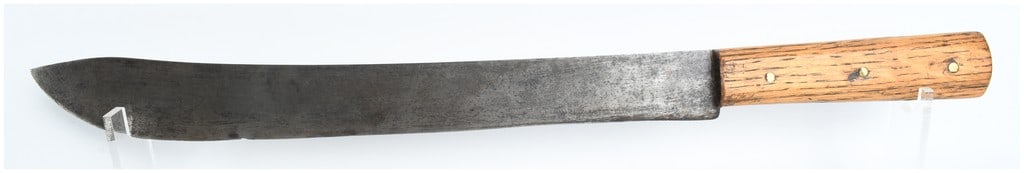 Large Antique Carbon Steel Butcher Knife with Wood Handle: A single large antique fixed-blade butcher knife featuring an upswept carbon steel blade in a cimiter or scimitar profile. The knife is constructed with a full tang and two wood handle scales, likely 