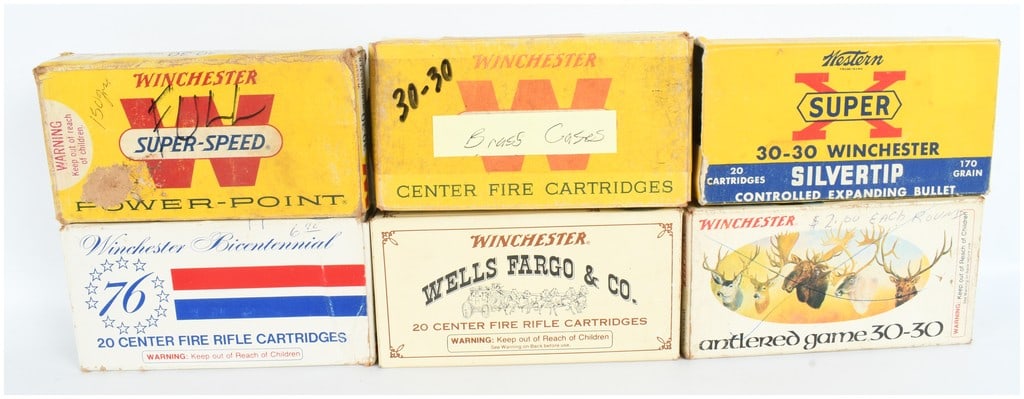 A Collection of 25 Live Rounds and 58 Empty .30-30 Winchester Casings for Reloading: This lot features a collection of 25 live rounds and 58 empty casings for reloading, all chambered in .30-30 Winchester. The items are accompanied by six vintage cardboard ammunition boxes from Winche