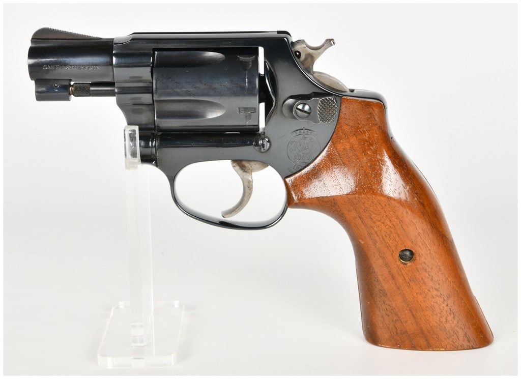 Smith & Wesson Model 36 Double-Action Revolver .38 Special with 1.875 Inch Barrel: This Smith & Wesson Model 36 is a double-action revolver chambered in .38 Special, built on the compact J-frame with a five-shot swing-out cylinder. It features a snub-nose 1.875-inch barrel and is co