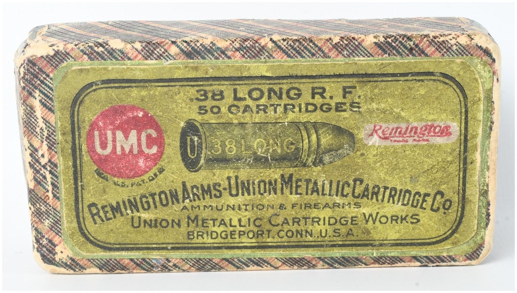 Remington Arms-Union Metallic Cartridge Co. .38 Long Rimfire Ammunition Antique: A lot of 33 rounds of .38 Long Rimfire ammunition contained in a partial, two-piece cardboard box manufactured by the Remington Arms-Union Metallic Cartridge Company. The box is wrapped in a character