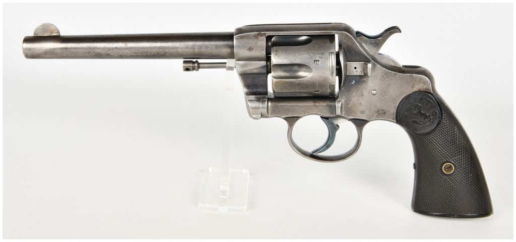 Colt Model 1895 Double Action Revolver .38 Caliber with 6 Inch Barrel Antique: This Colt Model 1895 double action revolver is chambered in .38 caliber and features a 6 inch round barrel. The firearm is equipped with a swing out six shot cylinder and fixed sights, consisting of a