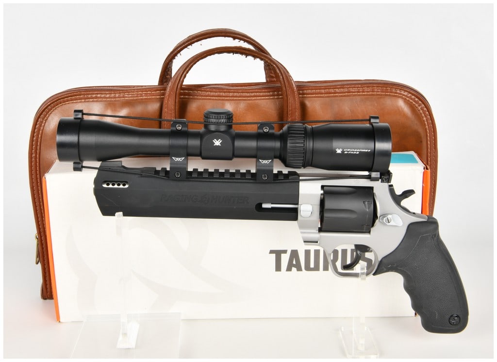Taurus Raging Hunter Double Action Revolver .44 Magnum with 8.375 Inch Barrel: This is a Taurus Raging Hunter double-action revolver chambered in .44 Magnum, configured as a high-performance hunting handgun. It features an 8.375-inch barrel housed within a matte black shroud tha