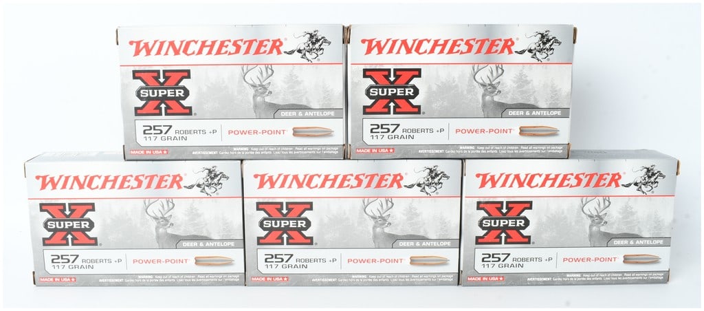 A Lot of 100 Rounds of Winchester Super-X .257 Roberts +P Ammunition: This lot features 100 rounds of Winchester Super-X centerfire rifle ammunition chambered in .257 Roberts +P. The ammunition is contained within five original cardboard boxes, each holding 20 rounds. T