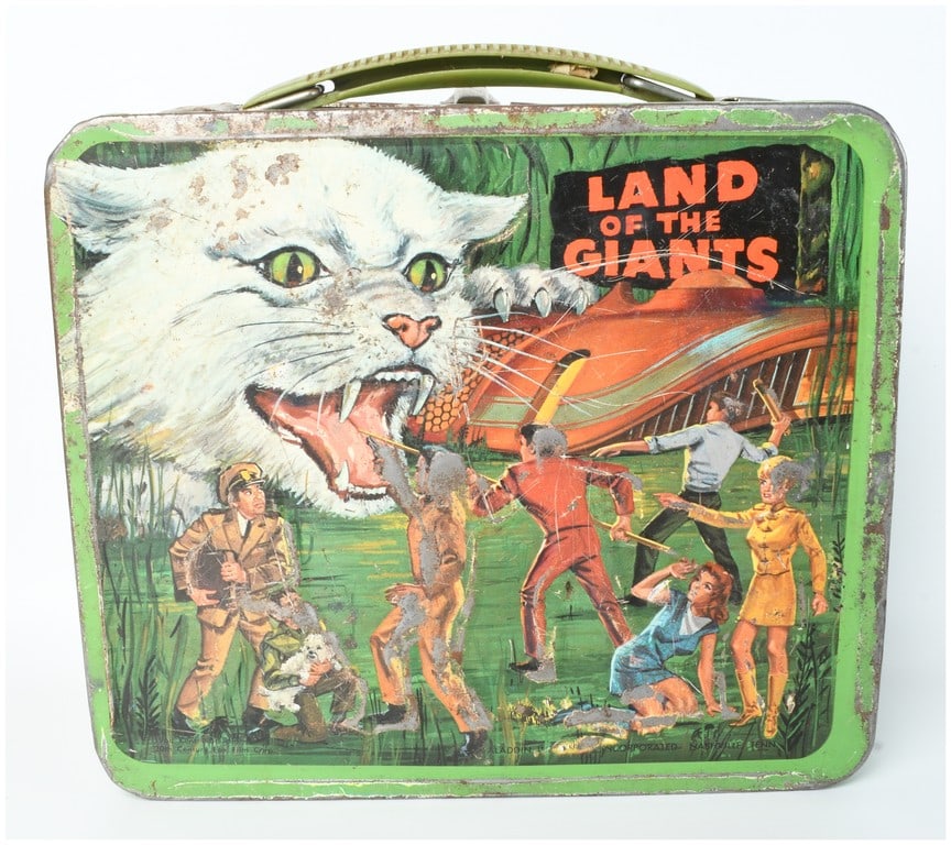 1968 Aladdin Land of the Giants Metal Lunch Box: This vintage metal lunch box is manufactured by Aladdin Industries, Incorporated, based on the 1968 Irwin Allen science fiction television series Land of the Giants. The construction is lithographed t