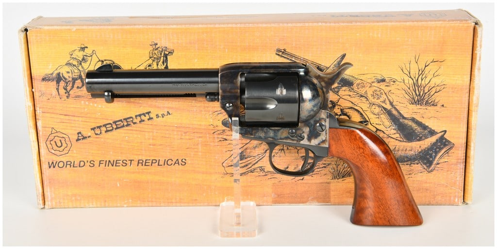 Uberti Model 1873 Cattleman Single Action Revolver .22 LR with 4.75 Inch Barrel: An A. Uberti Model 1873 Cattleman single action revolver chambered in .22 Long Rifle, imported by Taylor's & Co. This firearm is equipped with a 4.75-inch blued barrel, a six-shot blued cylinder, and 