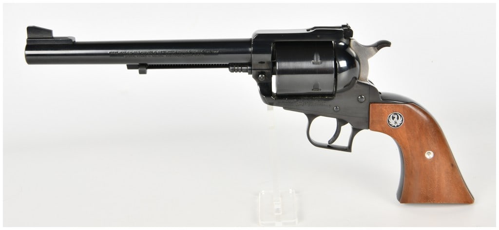 Ruger New Model Super Blackhawk Single Action Revolver .44 Magnum with 7.5 Inch Barrel: This single-action Ruger New Model Super Blackhawk revolver is chambered in .44 Magnum and is equipped with a 7.5-inch barrel. The firearm exhibits a deep high-polish blued finish on the barrel, frame