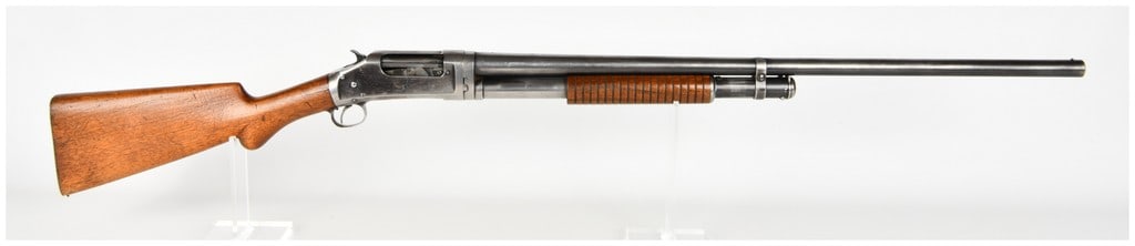 Winchester Model 97 Pump Action Shotgun 12 Gauge with 30 Inch Barrel 1902: This is a Winchester Model 97 pump-action shotgun chambered in 12 gauge, featuring a takedown frame design and a classic external hammer. The shotgun is configured with a approximately 30-inch barrel 