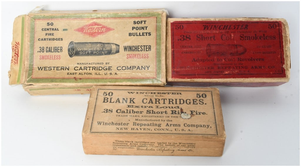 A Lot of 110 Winchester and Western .38 Caliber Cartridges and Blanks in Factory Boxes: This lot consists of three vintage ammunition boxes totaling 60 live rounds and 50 blank cartridges. Included is a green and buff two-piece box from the Western Cartridge Company of East Alton, Illino