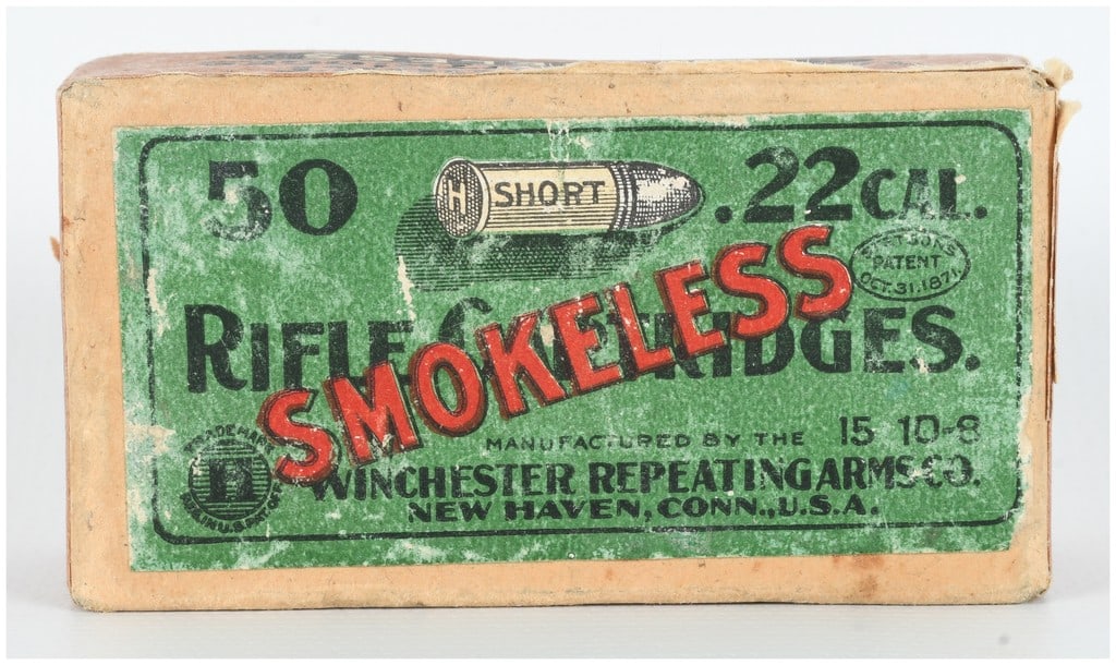 A Lot of 50 Winchester .22 Short Smokeless Rifle Cartridges: A complete lot containing 50 Winchester .22 Short smokeless target rifle cartridges housed in their original two-piece cardboard box. The green top label features a prominent red diagonal SMOKELESS ov