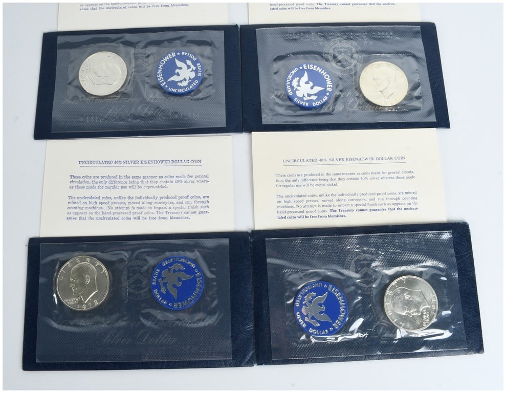4 1972-S US Eisenhower 40% Silver Uncirculated Dollar Sets: A group of 4 1972-S Eisenhower dollars, commonly referred to as Blue Ikes. These 40 percent silver coins were struck at the San Francisco Mint, as indicated by the S mint mark on the obverse. The coin