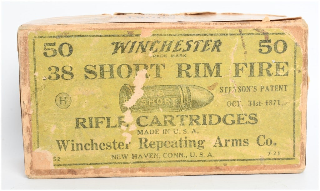 A Lot of 44 Winchester .38 Short Rim Fire Cartridges Antique: This lot consists of 44 rounds of Winchester .38 Short Rim Fire ammunition housed in an original two-piece cardboard box. These cartridges feature copper cases and lead bullets, designed for use in ri