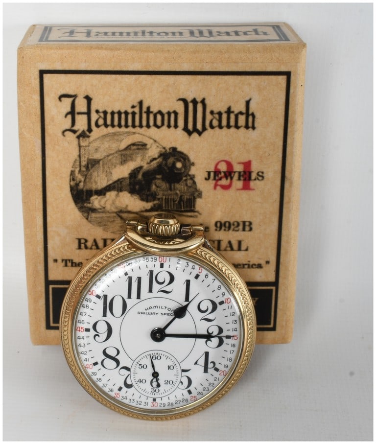 Hamilton Railway Special Grade 992B 21 Jewel Pocket Watch in 10K Gold Filled Case with Original Box: A single Hamilton Watch Company Railway Special pocket watch, Grade 992B, complete with its original printed cardboard presentation box. The timepiece features a 21-jewel movement housed in a 10K gold