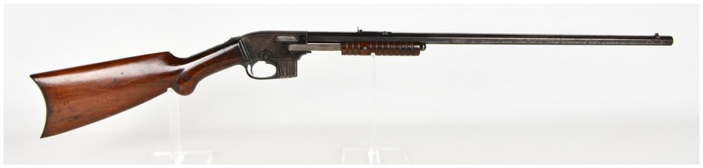 Savage Model 1903 Pump Action Rifle .22 S. L. & L.R. with Octagonal Barrel: This Savage Model 1903 is a pump-action, takedown rifle chambered for .22 Short, Long, and Long Rifle rimfire cartridges. The firearm features an octagonal barrel and a distinctive detachable box maga