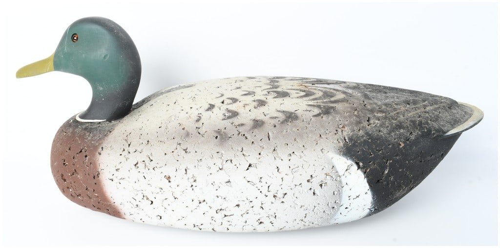 Cork and Wood Mallard Drake Duck Decoy: A mallard drake duck decoy featuring a textured cork body and a carved wooden head. The head is finished with matte green paint, a white neck ring, and inset amber-colored glass eyes. The body is pain