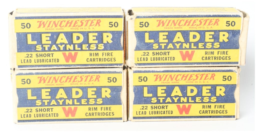 A Lot of 4 Boxes of Winchester Leader Staynless .22 Short Ammunition 200 Rounds: A lot of four vintage boxes of Winchester Leader Staynless .22 Short rimfire ammunition, totaling 200 rounds. Each yellow, blue, and red cardboard box is marked to contain 50 lead lubricated cartridge