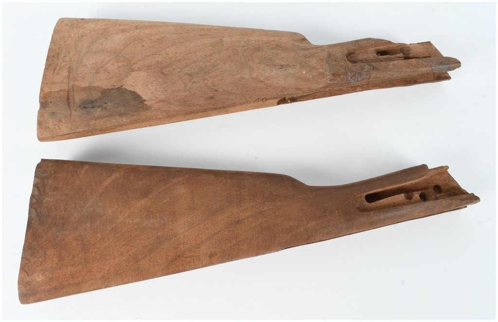 A Pair of Yugoslavian M70 Pattern Wooden Rifle Buttstocks: A pair of unfinished wooden rifle buttstocks, attributed to the Yugoslavian M70 pattern of the AK-type rifle. These stocks are constructed from raw, unvarnished wood and feature internal routing desig
