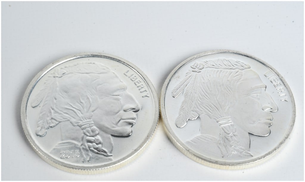 A Pair of 1 Troy Ounce .999 Fine Silver Buffalo Rounds: This lot consists of two silver bullion rounds produced by private refiners, featuring the iconic Indian Head and Buffalo design modeled after the historic United States Buffalo Nickel. Each round is 