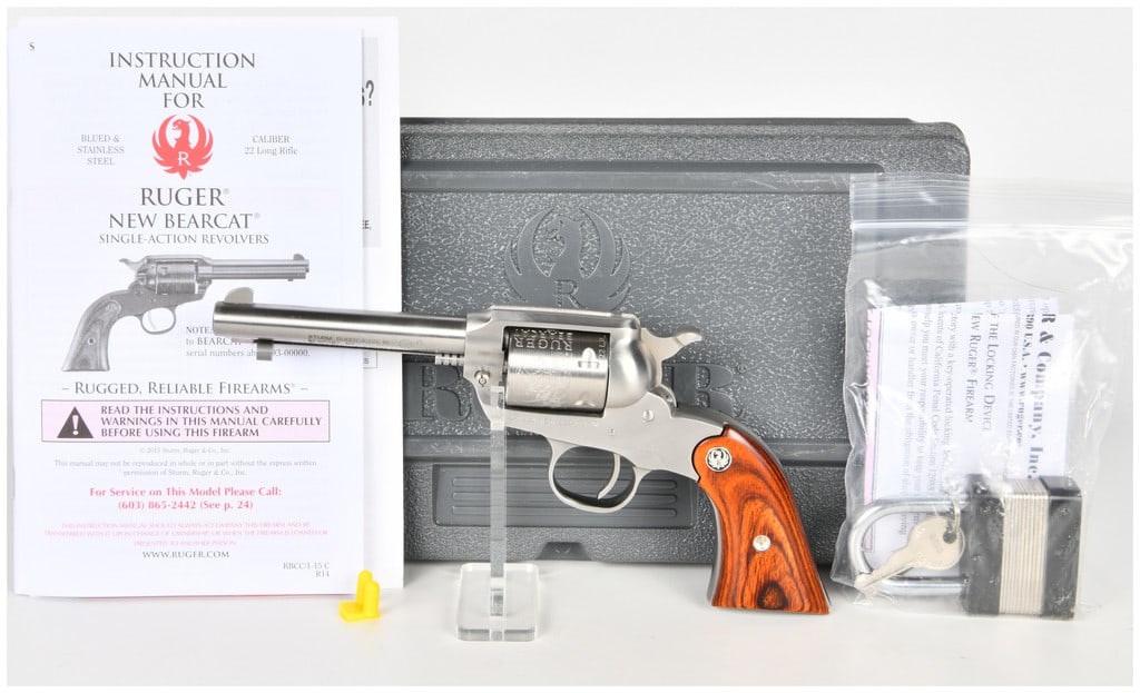 Ruger New Bearcat Single-Action Revolver .22 Long Rifle with 4.2 Inch Barrel: This lot features a Ruger New Bearcat single-action revolver chambered in .22 Long Rifle. This compact firearm is equipped with a 4.2-inch round barrel, fitting the popular 4 inch barrel profile, and 