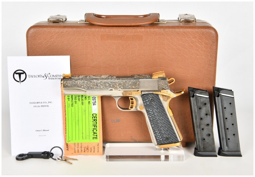 Highly Engraved Taylor's & Co. 1911A1-FS Semi-Auto Pistol 9mm Nickel & 24K Gold: This lot features a highly engraved semi-automatic M1911A1-style pistol chambered in 9mm, manufactured Taylor's & Co. Inc. The firearm features a 5 inch barrel and showcases a custom nickel-plated fin
