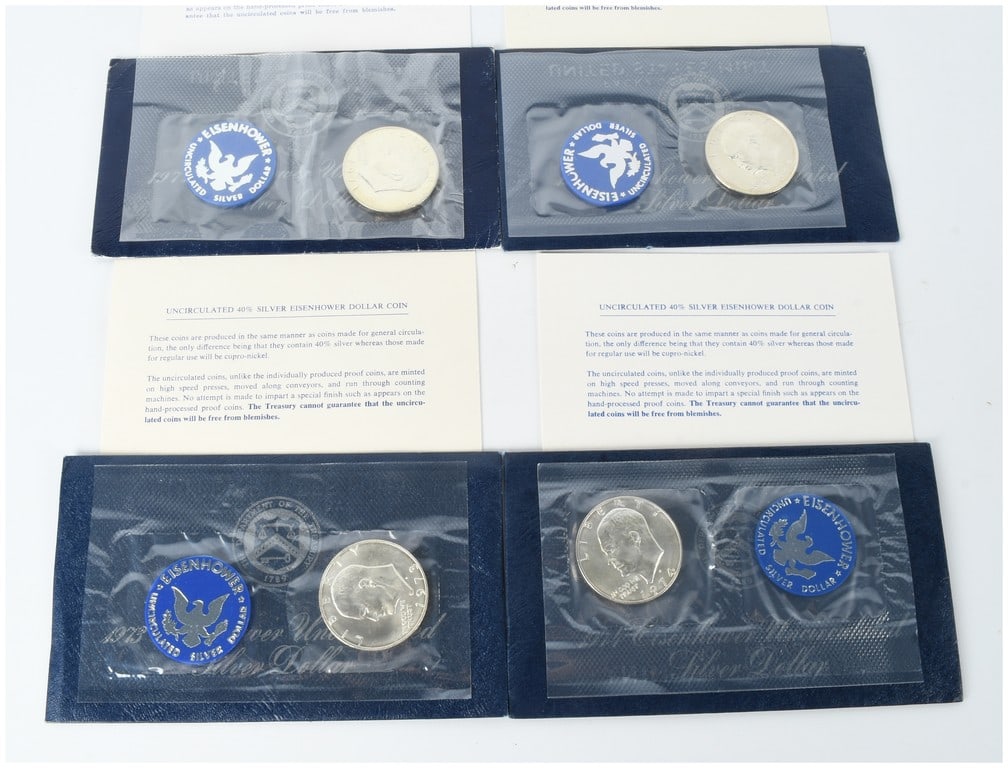 A Group of Four US 1971-S to 1974-S Eisenhower Silver Dollars Blue Pack Uncirculated: A group of four United States Eisenhower dollar coins struck in a 40% silver composition at the San Francisco Mint. This collection includes one specimen for each year of the series from 1971 through 