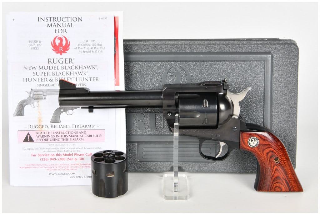 Ruger New Model Blackhawk Single-Action Revolver .45 Caliber with 5.5 Inch Barrel: This Ruger New Model Blackhawk is a convertible single-action revolver chambered for .45 caliber ammunition. The firearm features a dual-cylinder configuration, enabling it to fire both .45 Colt and .