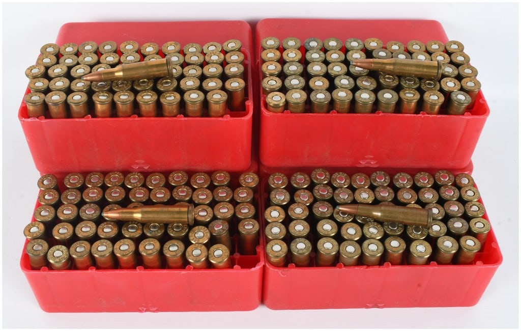 A Lot of 200 Rounds of Winchester-Western Reman .218 Bee Centerfire Rifle Ammunition: This lot consists of 200 rounds of reman .218 Bee centerfire rifle ammunition, neatly organized into four red plastic 50-round storage trays. Each cartridge features a brass case and a copper-jacketed