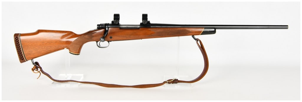 Winchester Model 70 Bolt Action Rifle .30-06 Springfield: This Winchester Model 70 bolt action rifle is chambered in .30-06 Springfield and is configured as a sporting rifle for big game hunting. The firearm features a blued finish on the metal components, a