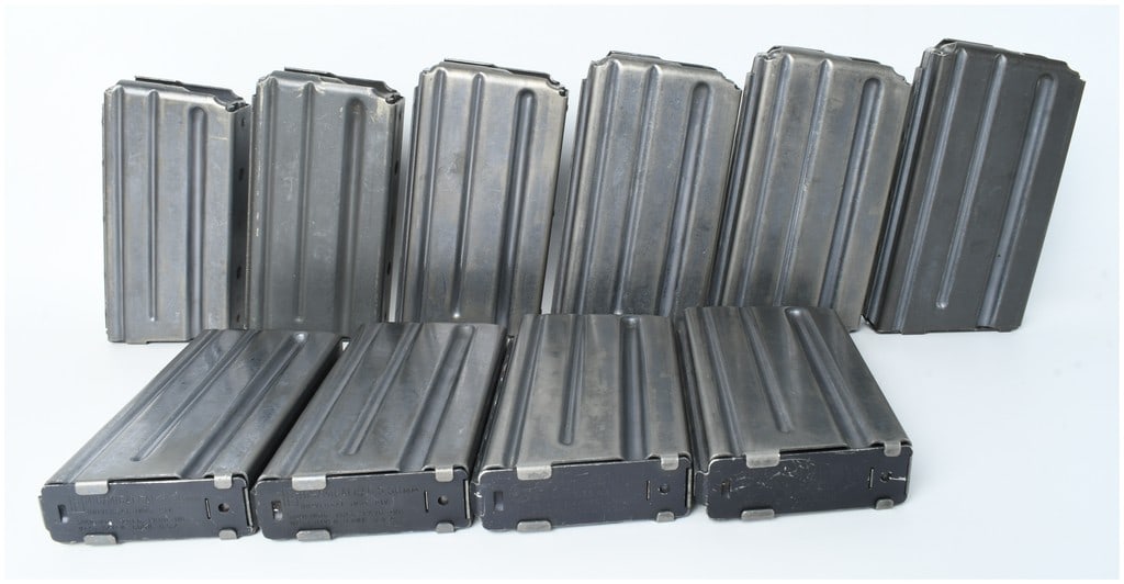 A Lot of 10 Colt and USGI Contract AR-15/M16 20-Round Magazines 5.56mm: This lot consists of ten detachable box magazines designed for the AR-15 and M16 rifle platform, featuring a twenty-round capacity and a straight-walled profile. The magazines are constructed from lig