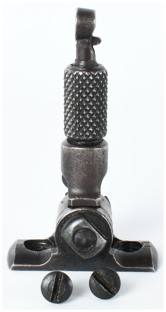 Marble's Flexible Peep Tang Sight with Mounting Screws: This Marble's Flexible Peep Tang Sight is a steel accessory designed for vintage lever-action rifles. The unit features a blued finish and a knurled elevation adjustment sleeve. It is built with a fol