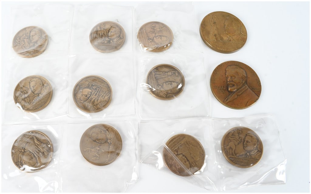 A Collection of US Bronze Commemorative Medals Featuring Frederic Remington and Crane Co.: This collection of bronze commemorative medals includes a series honoring the Western artist Frederic Remington and a corporate anniversary piece. The Remington medals, struck in two sizes, feature an