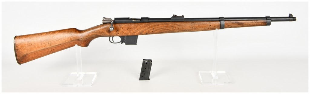 Spanish Destroyer Bolt Action Carbine 9mm Bergmann 1961: This lot features a Spanish Destroyer bolt-action carbine chambered for the 9mm Bergmann cartridge, also known as 9mm Largo. This compact firearm is designed with a blued steel barrel and receiver mou
