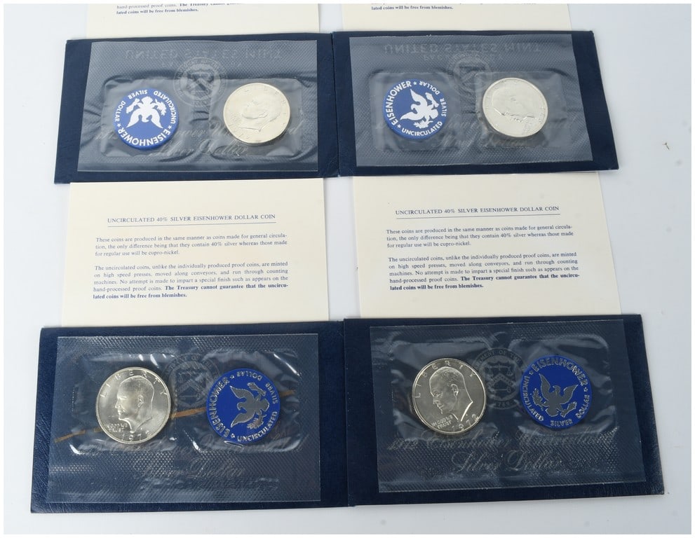 Four 1972-S US Eisenhower 40% Silver Dollars, Uncirculated: This lot comprises four US Eisenhower silver dollars struck at the San Francisco Mint in 1972. Each coin is composed of 40 percent silver and 60 percent copper-nickel cladding, as specified in the inc