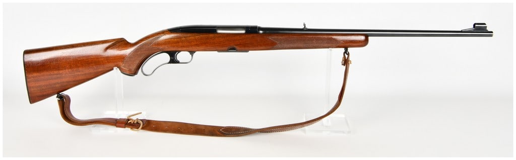 Winchester Model 88 Lever Action Rifle .308 Winchester with 22 Inch Barrel: This Winchester Model 88 lever-action rifle is chambered in .308 Winchester and features a 22-inch barrel. The rifle is configured with a blued steel finish on the barrel and receiver, paired with a o