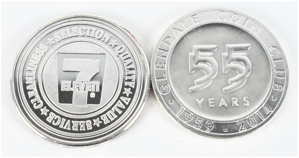 A Pair of .999 Fine Silver 1 Troy Ounce Bullion Rounds including 7-Eleven Millennium Commemorative: This lot consists of two silver bullion rounds, each containing 1 troy ounce of .999 fine silver. The first round is a corporate commemorative produced for 7-Eleven to mark the turn of the millennium,