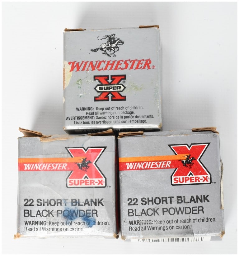 A Lot of 150 Winchester Super-X .22 Short Blank Black Powder Cartridges: This lot consists of 150 Winchester Super-X .22 Short blank cartridges loaded with black powder. These rimfire blanks are contained within three original silver-colored cardboard boxes featuring red a