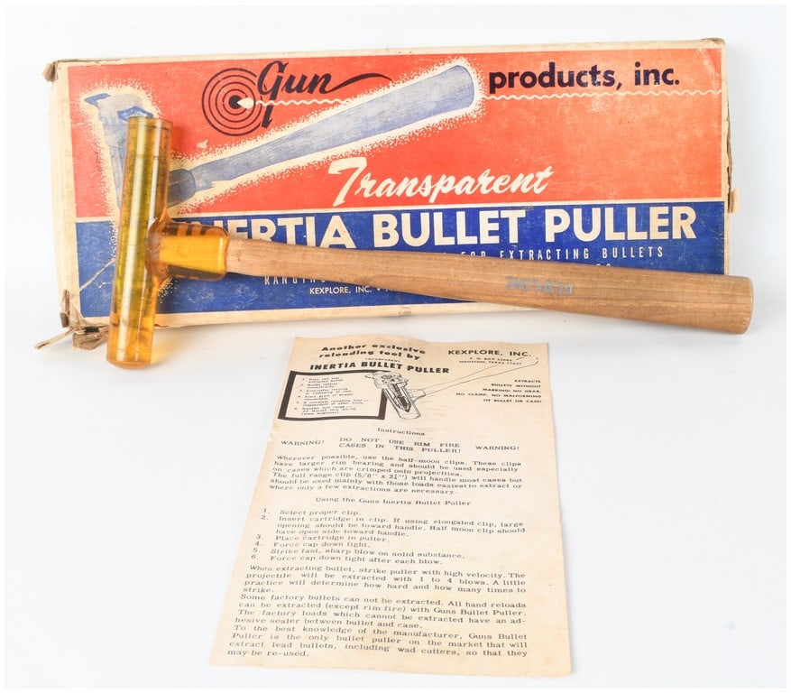 Vintage Kexplore Inc. Transparent Inertia Bullet Puller with Original Box and Instructions: This lot features a vintage inertia bullet puller manufactured by Kexplore, Inc. of Houston, Texas. The tool consists of a transparent amber-colored impact-resistant plastic head mounted on a turned w