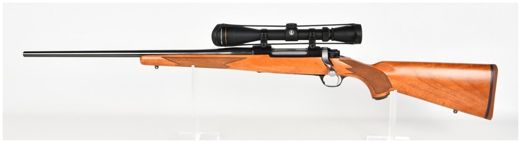 Ruger M77 Hawkeye Left-Hand Bolt-Action Rifle .30-06 Springfield: This is a Ruger M77 Hawkeye bolt-action rifle chambered in .30-06 Springfield, specifically designed in a left-handed configuration. The rifle features a polished blued steel barrel and receiver, whil