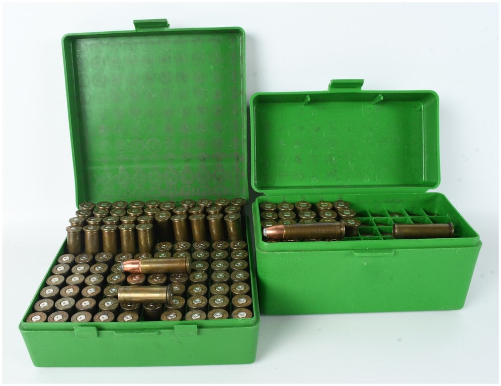 A Collection of 157 .375 SM and .375 Rocket XL Ammunition Rounds and Brass Casings: This lot consists of a collection totaling 60 rounds and 97 empty brass casings of .375 SM and .375 Rocket XL ammunition. The collection is housed within two green plastic ammunition storage boxes. Vi